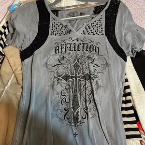 Nice affliction shirt good condition other than the hole in the arm